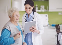 Woman with doctor tablet
